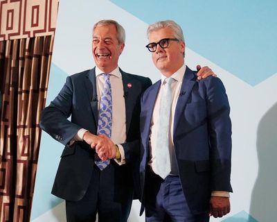 Farage dodges press as he unveils Reform’s first peer after Conservative defection