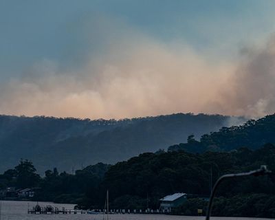 NSW Central Coast ‘not out of the woods yet’ as bushfire conditions ease – as it happened