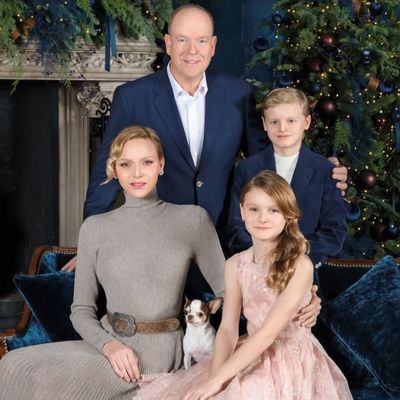 Princess Charlene, Prince Albert, and the Twins Trade Casual Christmas Sweaters for a Luxurious Fireside Snap