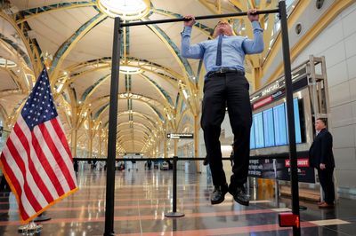 RFK Jr and Trump official do pull-ups in bizarre airport press conference