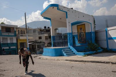 Dozens killed in Haiti's capital as armed men break away from gang coalition in bid for power