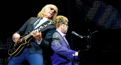 “There was a guy checking out people who were coming in, and he’d go over the microphone, ‘Now here’s Elton John and his band!’”: Davey Johnstone on guitar shopping with Elton John – and how he ended up with his iconic Les Paul Custom
