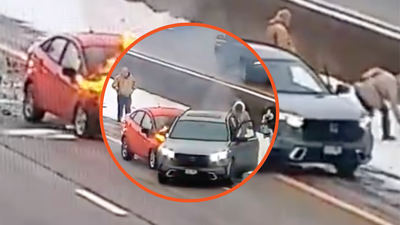 Minnesota onlookers chuck snow as car collides with an SUV and bursts into flame as driver tries and fails to escape the flames