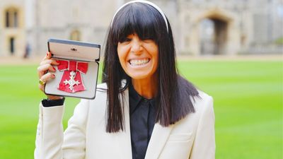Claudia Winkleman is 'speechless' to receive MBE from King Charles – and marks the moment in a chic white suit