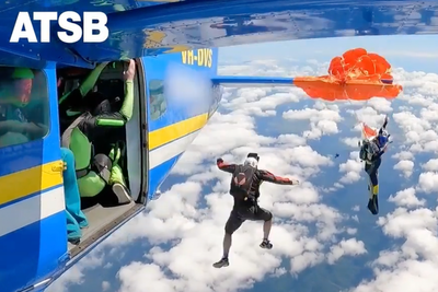 Skydiver cuts himself free after parachute became caught on plane’s tail mid-jump