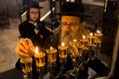 What is Hanukkah and how is the Jewish holiday celebrated?
