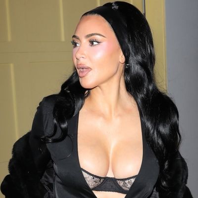 Kim Kardashian Styles a Peekaboo Bra Underneath a Vintage Black Dress From Tom Ford's Final Gucci Collection