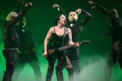 Lady Gaga forced to stop her Sydney show after dancer falls off the stage and suffers painful injury