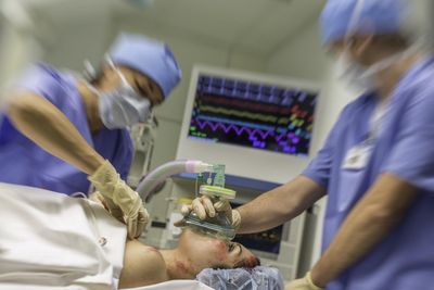 Children’s operations cancelled as super flu piles pressure on intensive care units