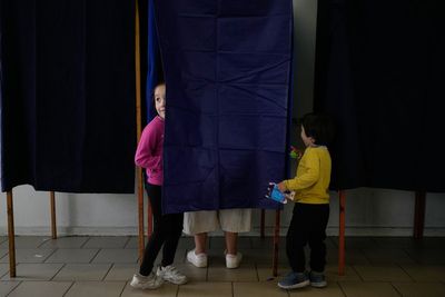 Photos of voters taking part in Chile's runoff presidential election
