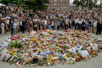 Met with a scene of horror at Bondi beach, strangers embraced, shed tears and gathered in silence
