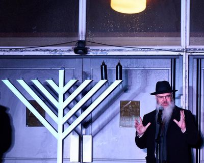 ‘We are reclaiming that light’: Hanukah celebrations tinged with sadness at Heaton Park synagogue