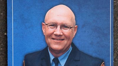 Dispute over alleged cop killer's court attendance