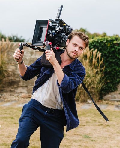 Moment cameraman run over and 'nearly beheaded' by Rolls Royce on north London film set