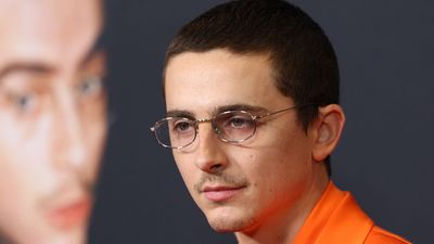 Timothée Chalamet Adorably Rocked Orange On The Marty Supreme Red Carpet With His Mom This Time