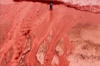 Rain creates a crimson spectacle on Iran's Hormuz Island for the first time this year