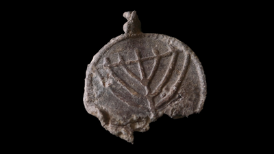 Rare 1,300-year-old medallion decorated with menorahs found near Jerusalem's Temple Mount
