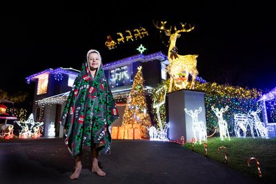 A flying Santa sleigh, 30,000 bulbs and extension leads galore: meet the Sydneysiders whose Christmas light show dazzles
