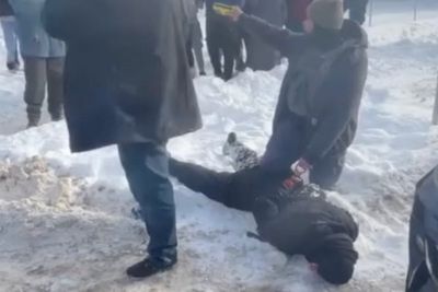 Woman is pinned face-down in snow then dragged across concrete by ICE during Minneapolis operation