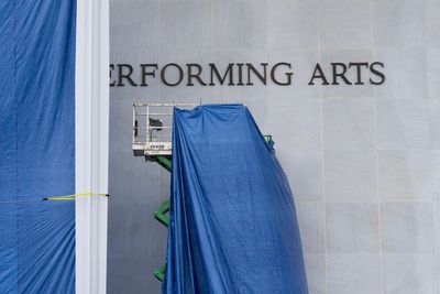 Photos of Trump's name being added to the Kennedy Center