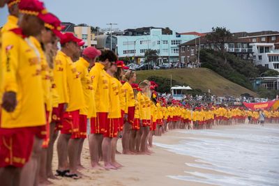 ‘This is our church’: Bondi lifesavers gather in their hundreds to honour shooting victims