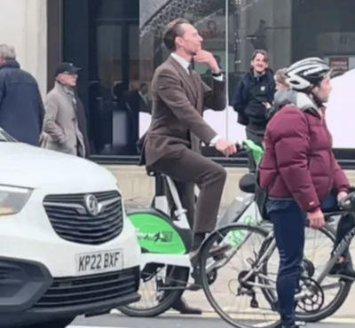 Tom Hiddleston stuns fans after being spotted riding Lime bike through central London in suit