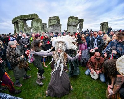 ‘I feel special, in my heart’: thousands gather at Stonehenge for winter solstice