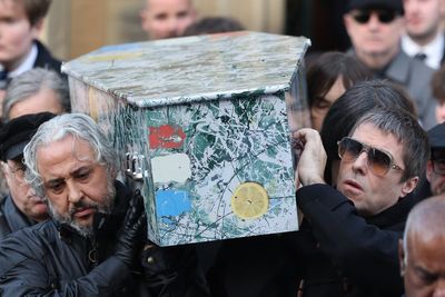 Liam Gallagher carries Gary 'Mani' Mounfield's coffin at Stone Roses bassist's funeral