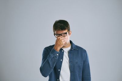 Why Men Are Feeling Burnout In A Culture Obsessed With Improvement