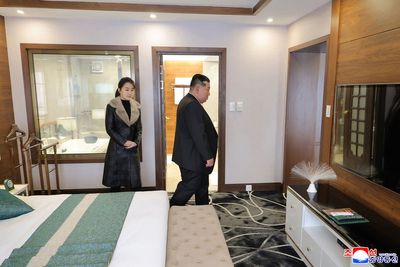 Kim Jong Un and daughter pictured visiting mountain resort, eating BBQ and testing beds in bizarre photoshoot