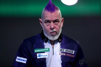 Peter Wright crashes out in round two after predicting he would win title