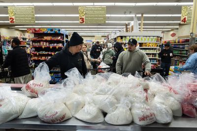 Families wait in line for hours to buy masa for Christmas tamales at beloved LA grocer