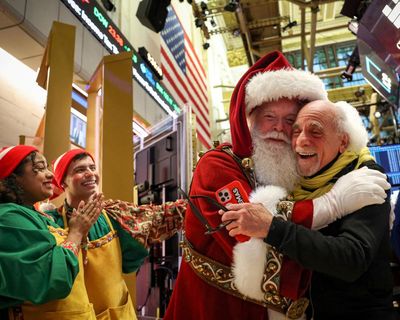 S&P 500 and Dow hit record highs as Santa rally reaches Wall Street – as it happened