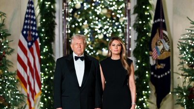 Trump and Melania Break Christmas Tradition With Somber All-Black White House Portrait