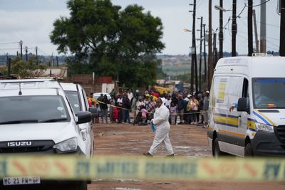 South African police continue arrests after mass shooting at a pub