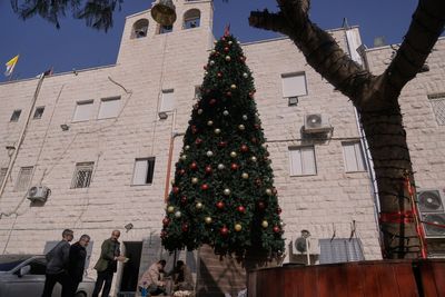3 Palestinians arrested on suspicion of torching a Christmas tree at a Catholic church in West Bank