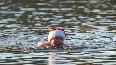 Winter swimmers take a plunge on Christmas Day in Berlin