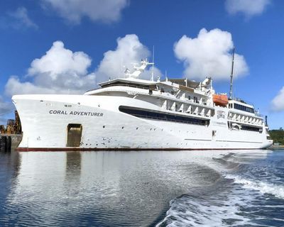 Australian cruise ship investigated after leaving passenger behind runs aground off PNG with 120 people on board