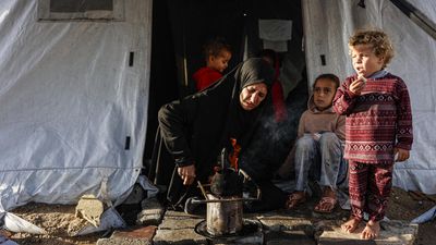 'Shivering from cold and fear': winter rains batter displaced Gazans