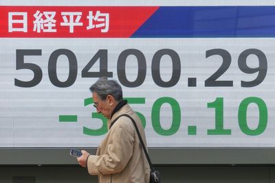 Asian shares are mixed in quiet holiday trading after a lackluster post-Christmas day on Wall St