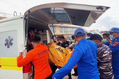 Indonesian rescuers find a body while searching for Spanish soccer coach and 3 children