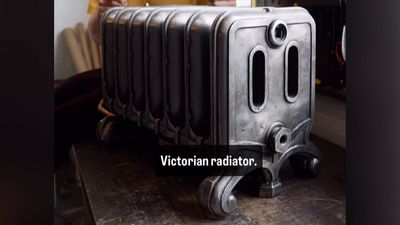 110-pound cast-iron Victorian radiator modded into a gaming PC — massive radiator used for cooling the bottom-mounted PC components