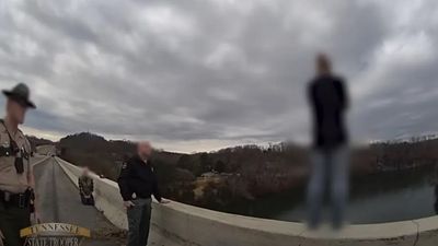 Chilling Video Captures Cop Saving Distraught Woman from Bridge After Christmas