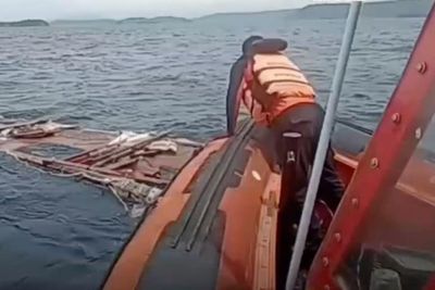 Rescuers search wreckage after football coach dies in Indonesian tour boat sinking