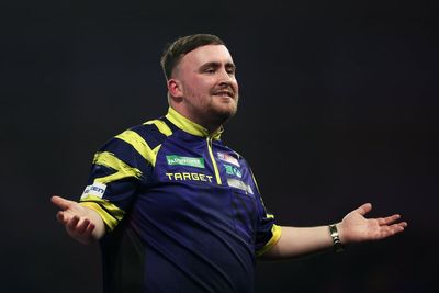 World Darts Championship: Luke Littler squeezes past Rob Cross to reach quarter-finals