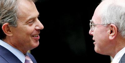 Tony Blair’s government discussed how to influence John Howard to commit Australian troops to Iraq