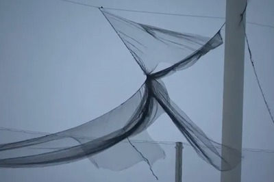 Moment TopGolf nets come crashing down after heavy snow as customers look on