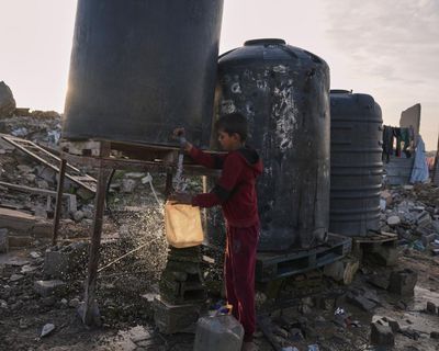 Israel to ban dozens of aid agencies from Gaza as 10 nations warn about suffering