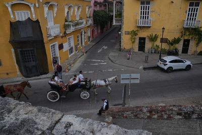 A Colombian city swaps iconic horse buggies for electric carriages amid animal welfare concerns