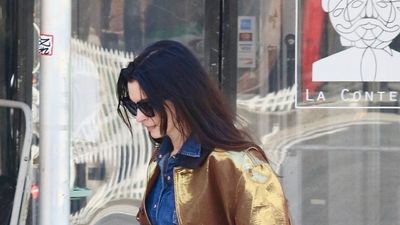 Anne Hathaway's maroon Adidas Sambas and metallic barn jacket feel like the freshest way to style denim in 2026
